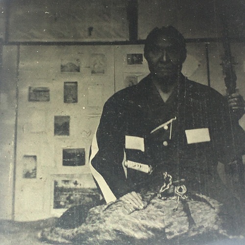 Unusual Ambrotype of a Samurai with other photos on background board 