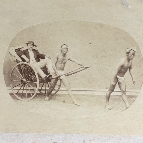 Medium format photo of George N. Mitchell in rickshaw Early, uncoloured albumen photo